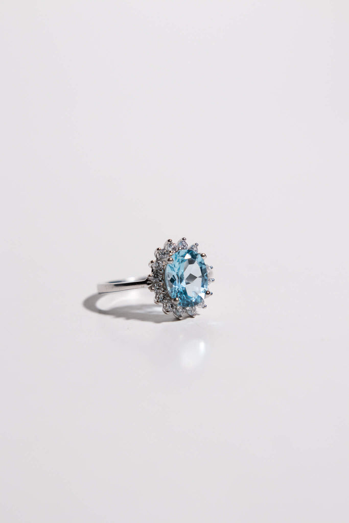 Oval Cut Aquamarine Ring with White Zircon Halo in Sterling Silver and Rhodium