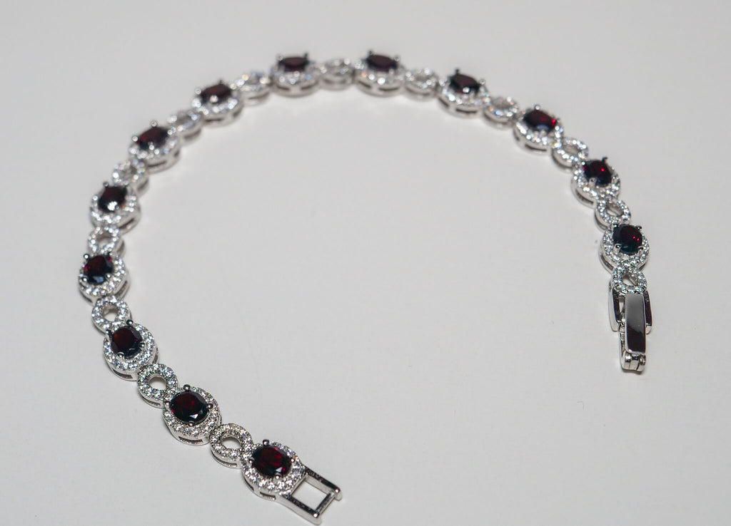 Oval Cut Garnet Bracelet with White Zircon in Sterling Silver and Rhodium
