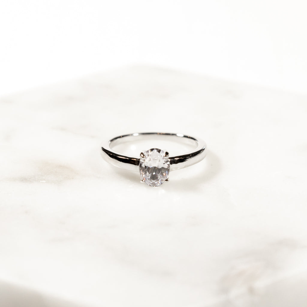 Oval Cut White Zircon Solitaire Ring in Sterling Silver and Rhodium