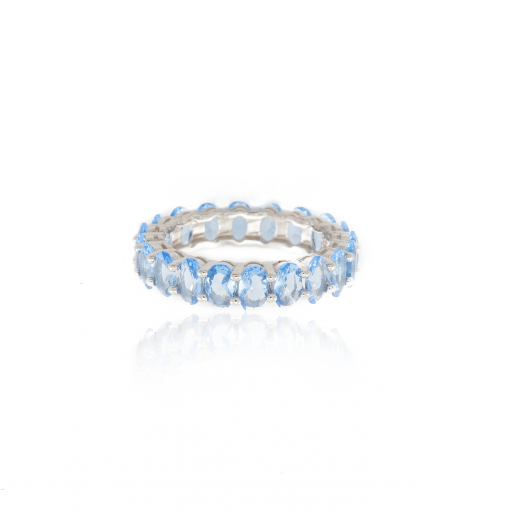 Oval Cut Blue Topaz Band Ring in Sterling Silver and Rhodium