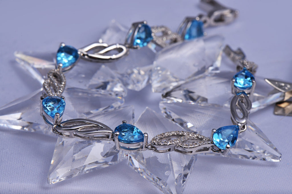 Bracelet With Blue Topaz & 5A Cubic Zirconia In Sterling Silver and Rhodium
