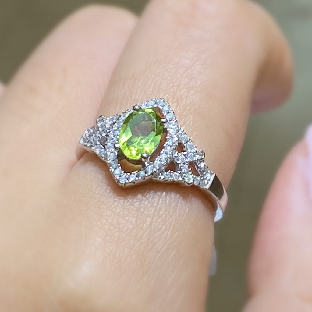 Oval Cut Peridot Ring with CZ Accents in Sterling Silver and Rhodium