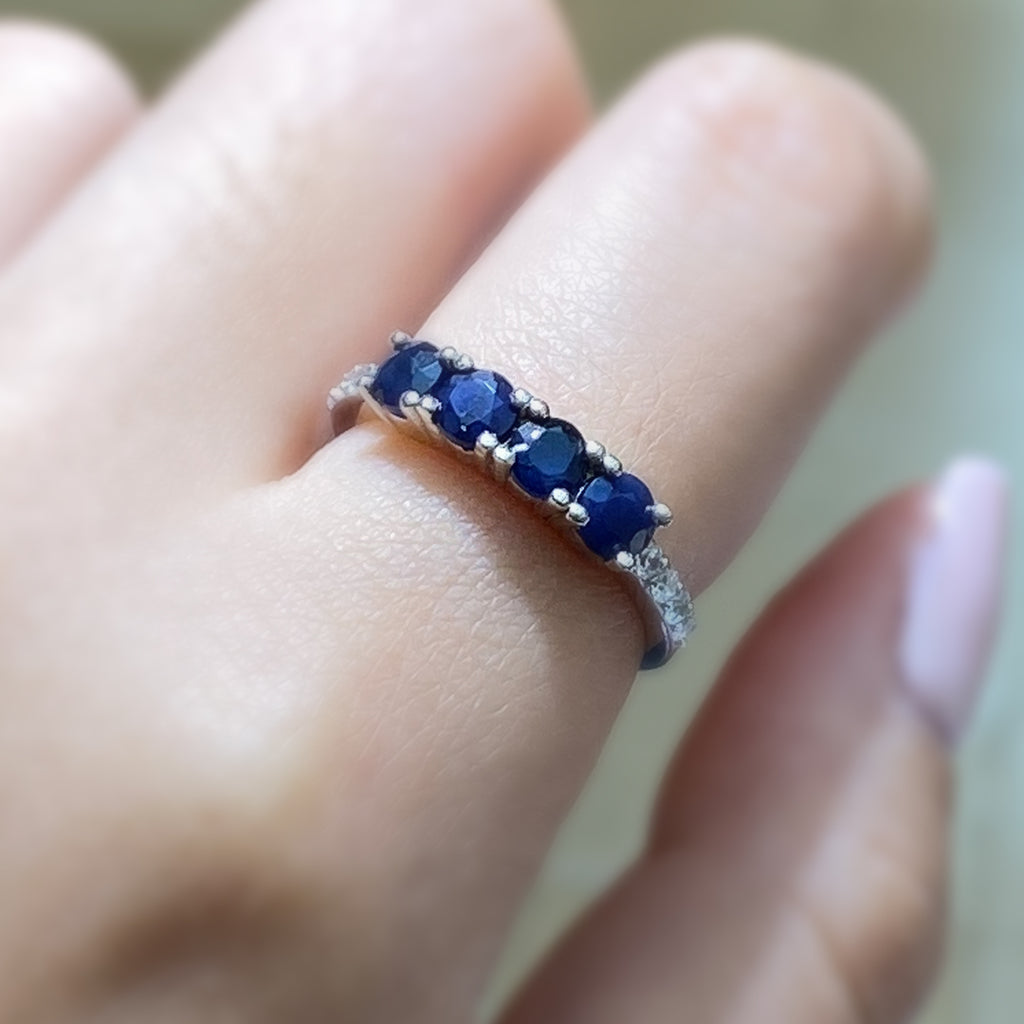 Four Stone Round Cut Sapphire Ring with Cubic Zirconia Accents in Sterling Silver and Rhodium